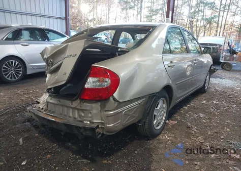 2002 Toyota Camry Le z USA, uszkodzony, nr VIN 4T1BF32K52U527952